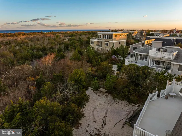 an aerial view of residential building and ocean