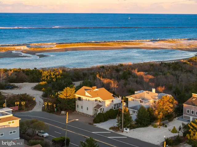 an aerial view of a house with a lake view