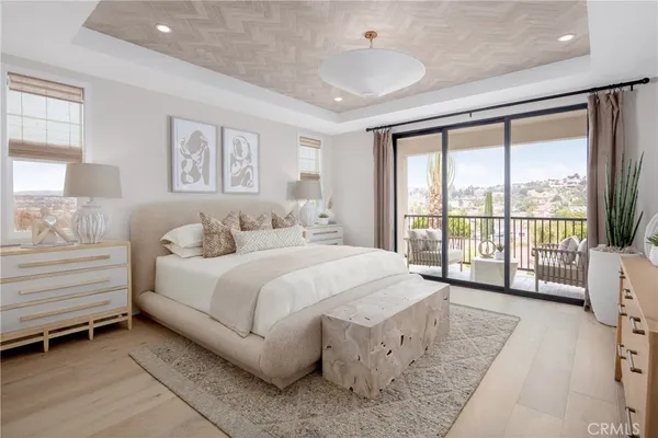 a spacious bedroom with a bed and a large window