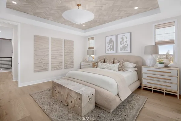 a spacious bedroom with a bed and a large window