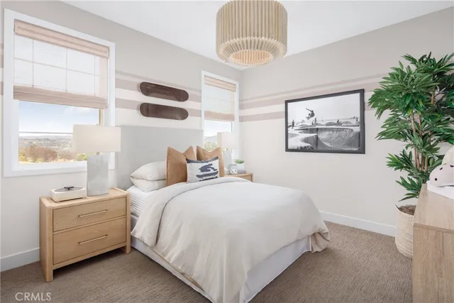 a bed room with a bed and a chandelier