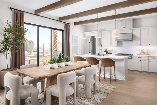 a view of kitchen with dining table and chairs