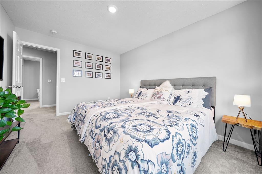 264 Lily Ridge Drive Canonsburg, PA 15317 - Photo 41 of 50 a bedroom with a bed and a lamp