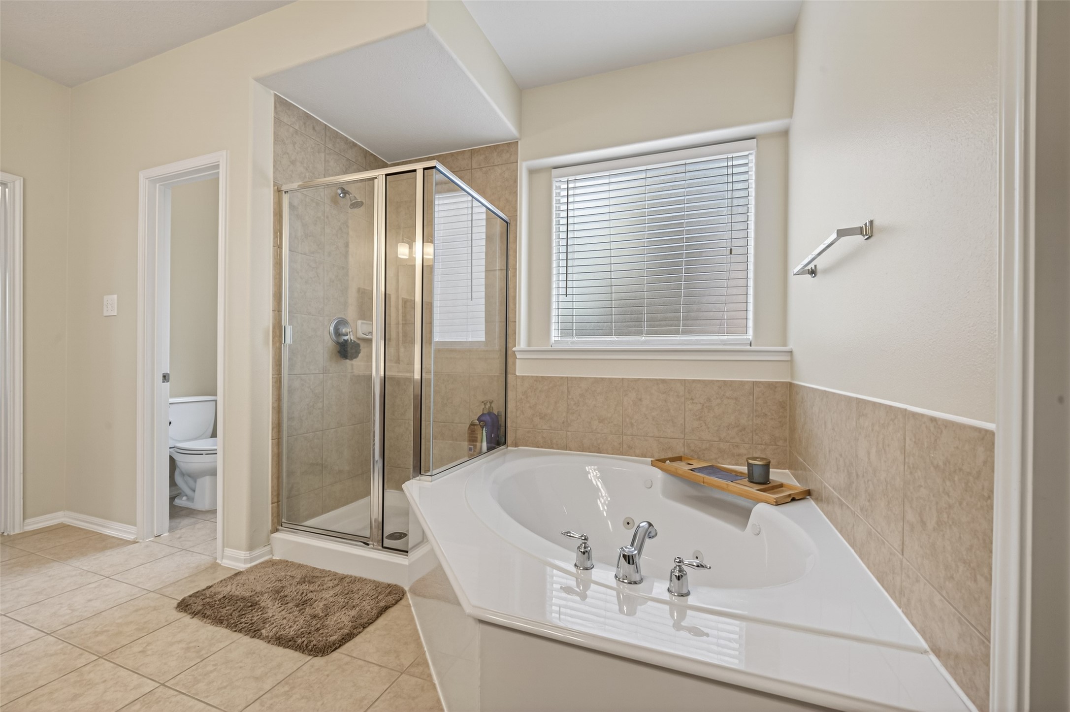 3219 Legends Mist Drive Spring, TX 77386 - Photo 23 of 37 a bathroom with a tub a sink and a shower