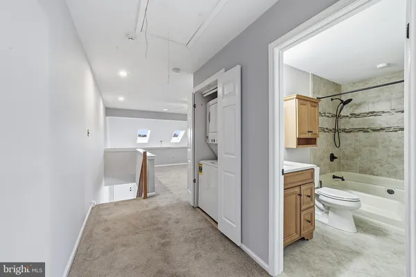 a bathroom with a shower a toilet and a shower