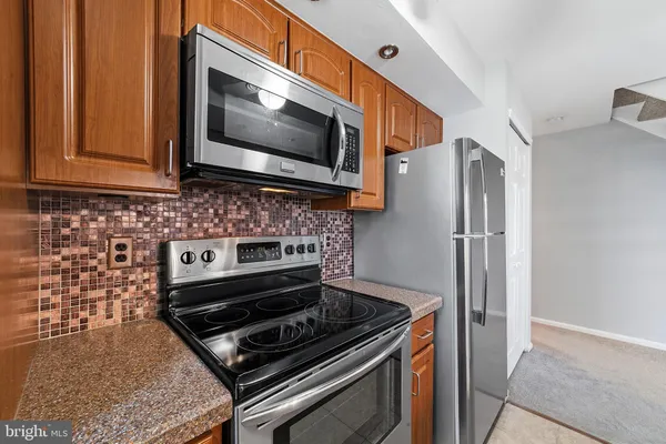 a kitchen with a stove and a microwave