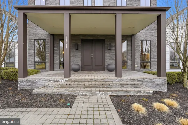 a bathroom with a double vanity sink a mirror and a shower