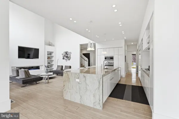 a bedroom with a bed and a potted plant on table