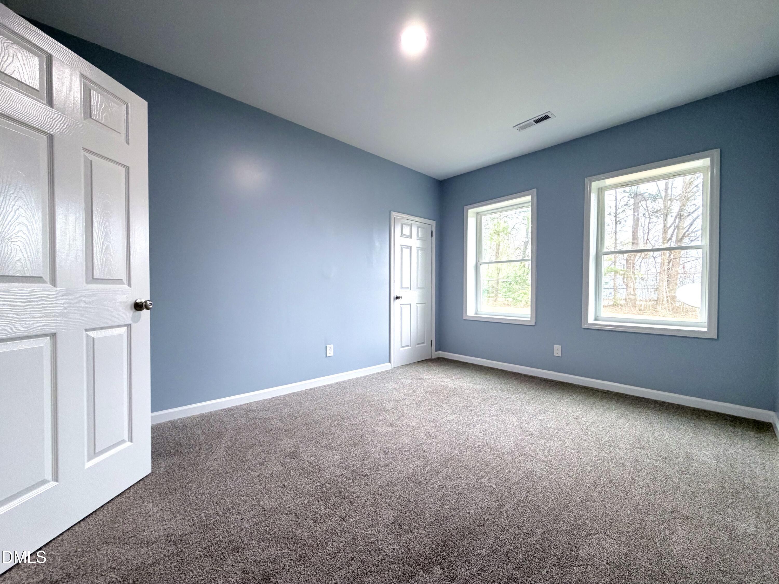 4408 Lee Street Ayden, NC 28513 - Photo 11 of 17 an empty room with windows