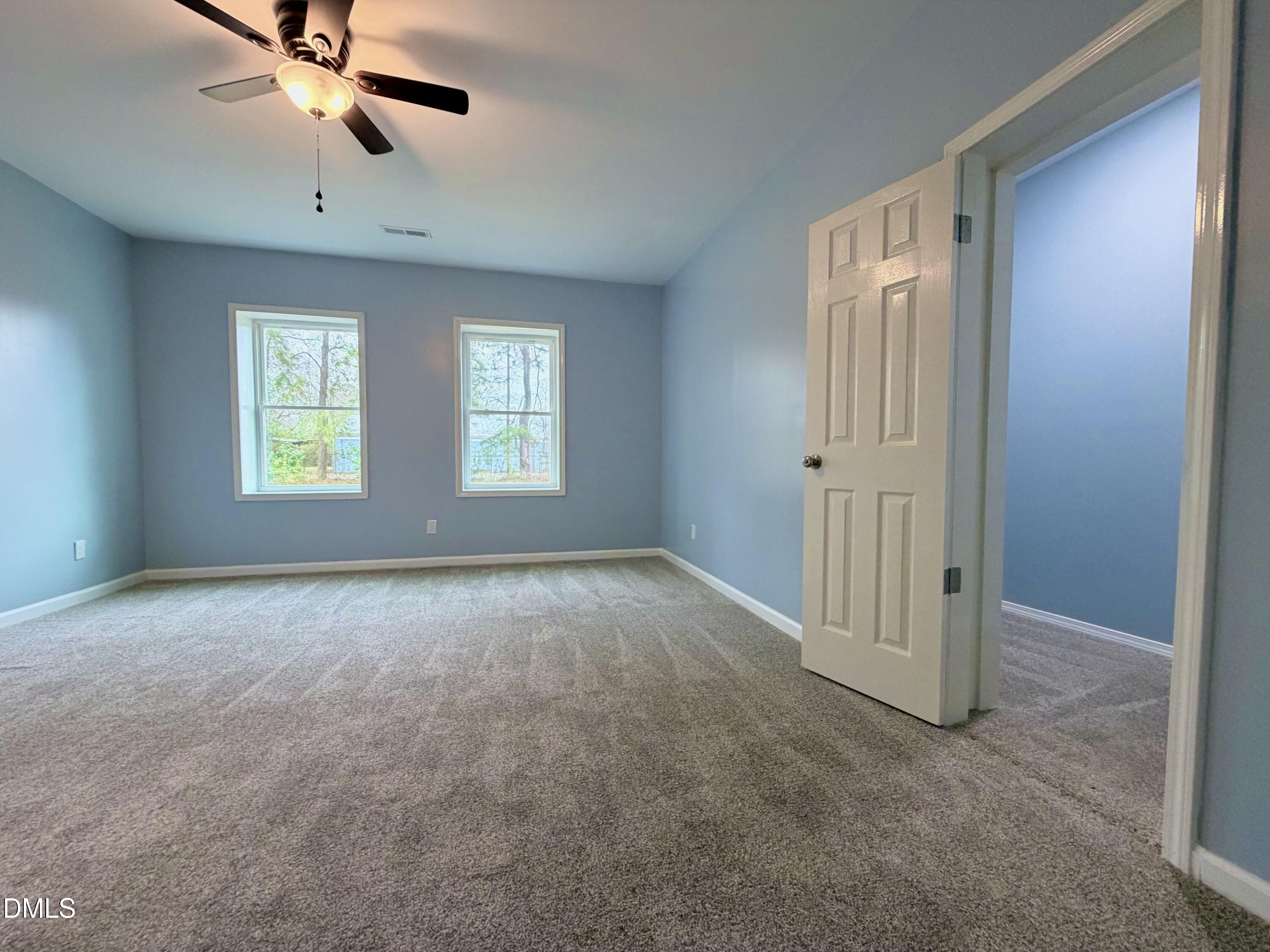 4408 Lee Street Ayden, NC 28513 - Photo 12 of 17 a view of empty room with windows