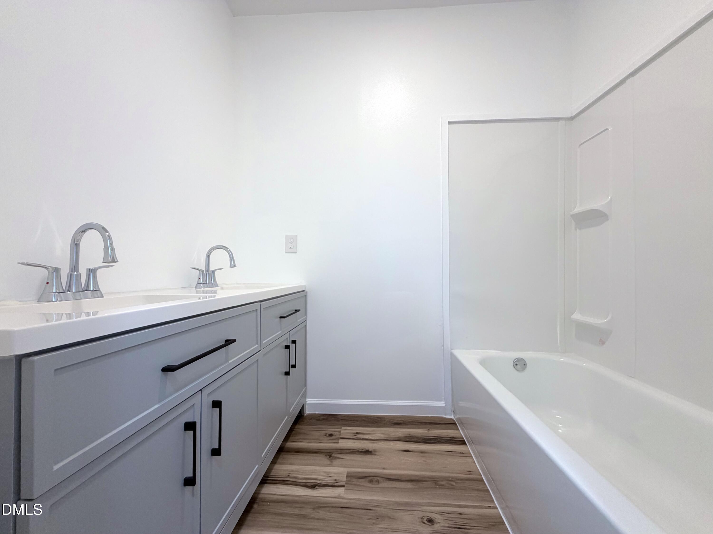 4408 Lee Street Ayden, NC 28513 - Photo 13 of 17 a bathroom with a sink and a bathtub