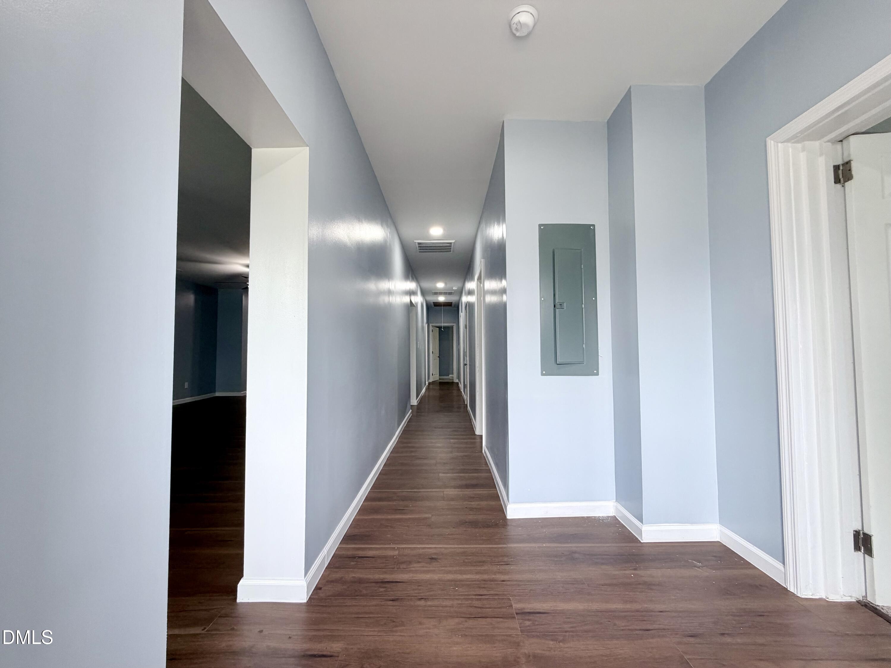 4408 Lee Street Ayden, NC 28513 - Photo 15 of 17 a view of a hallway with wooden floor