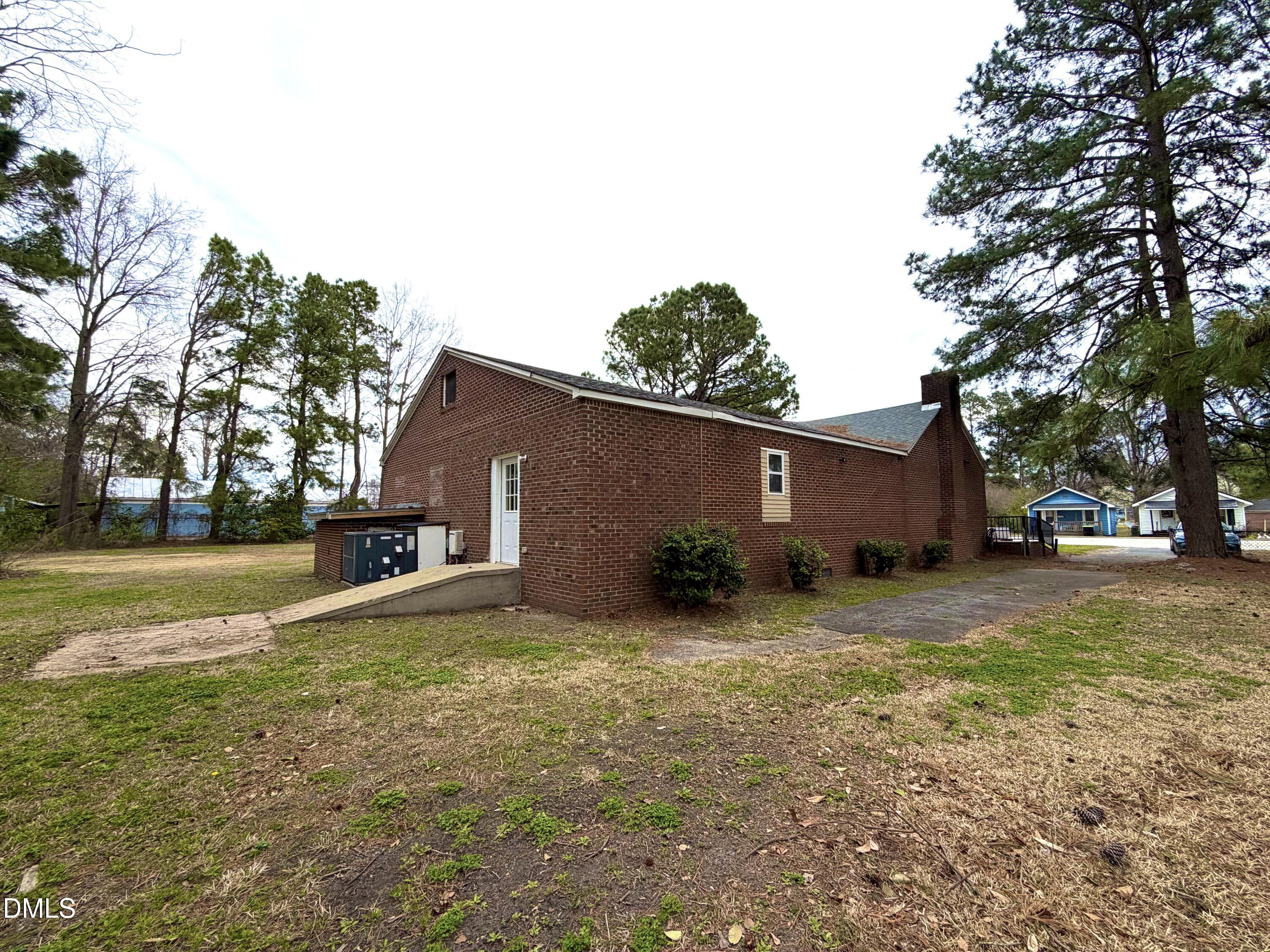 4408 Lee Street Ayden, NC 28513 - Photo 16 of 17 a view of a house with a yard