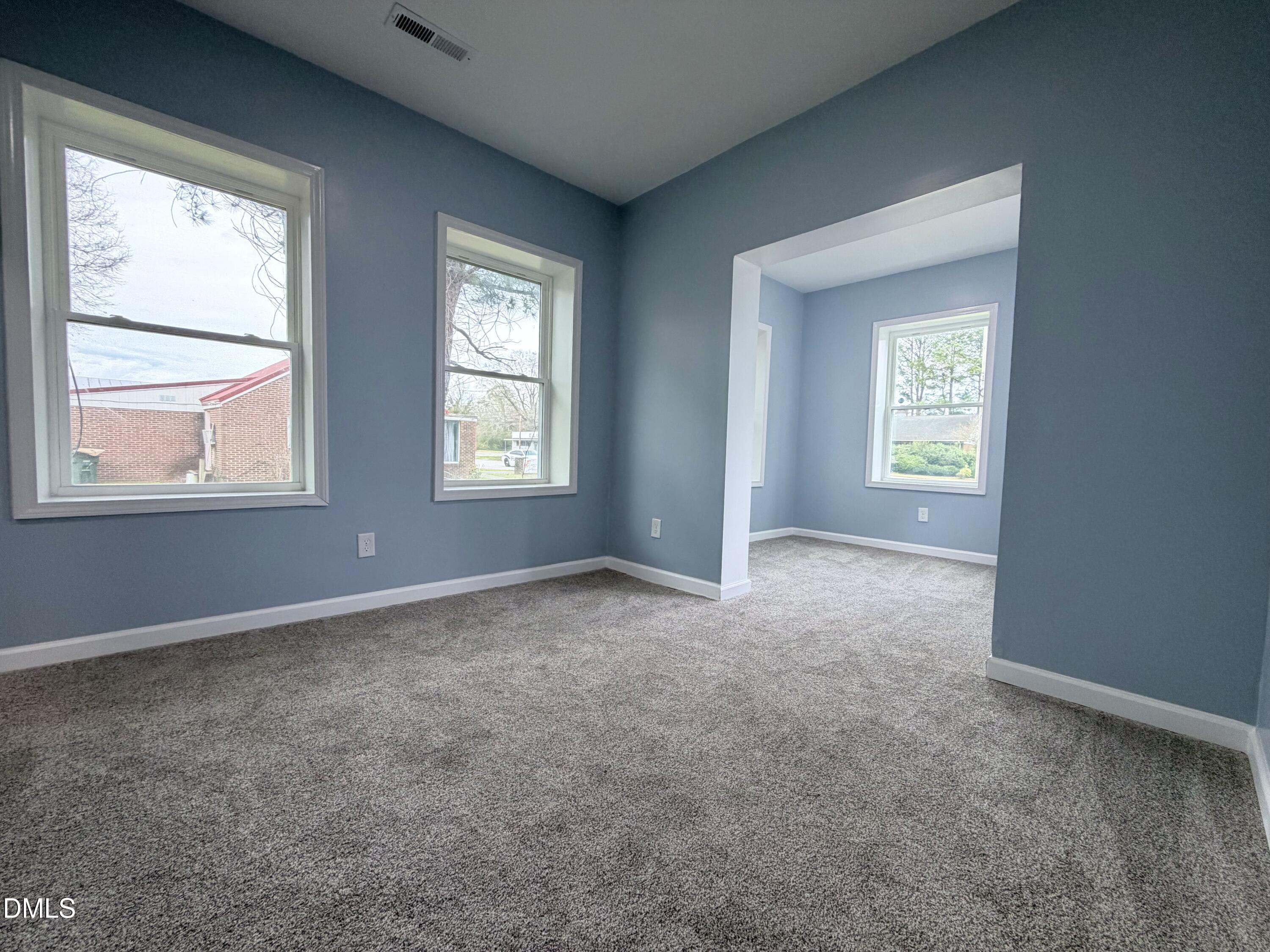 4408 Lee Street Ayden, NC 28513 - Photo 8 of 17 an empty room that has a window