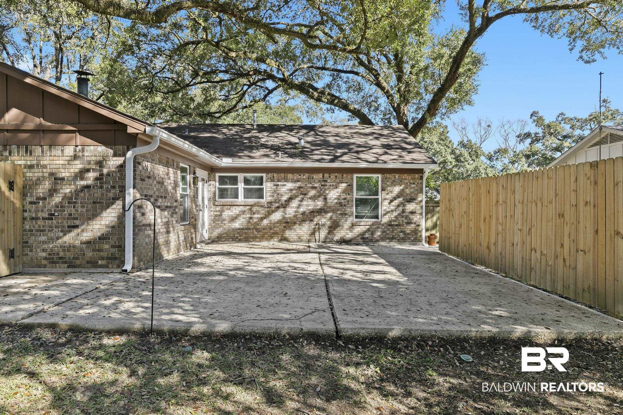5817 Woodgate Road Mobile, AL 36609 - Photo 65 of 85 View of patio with fence
