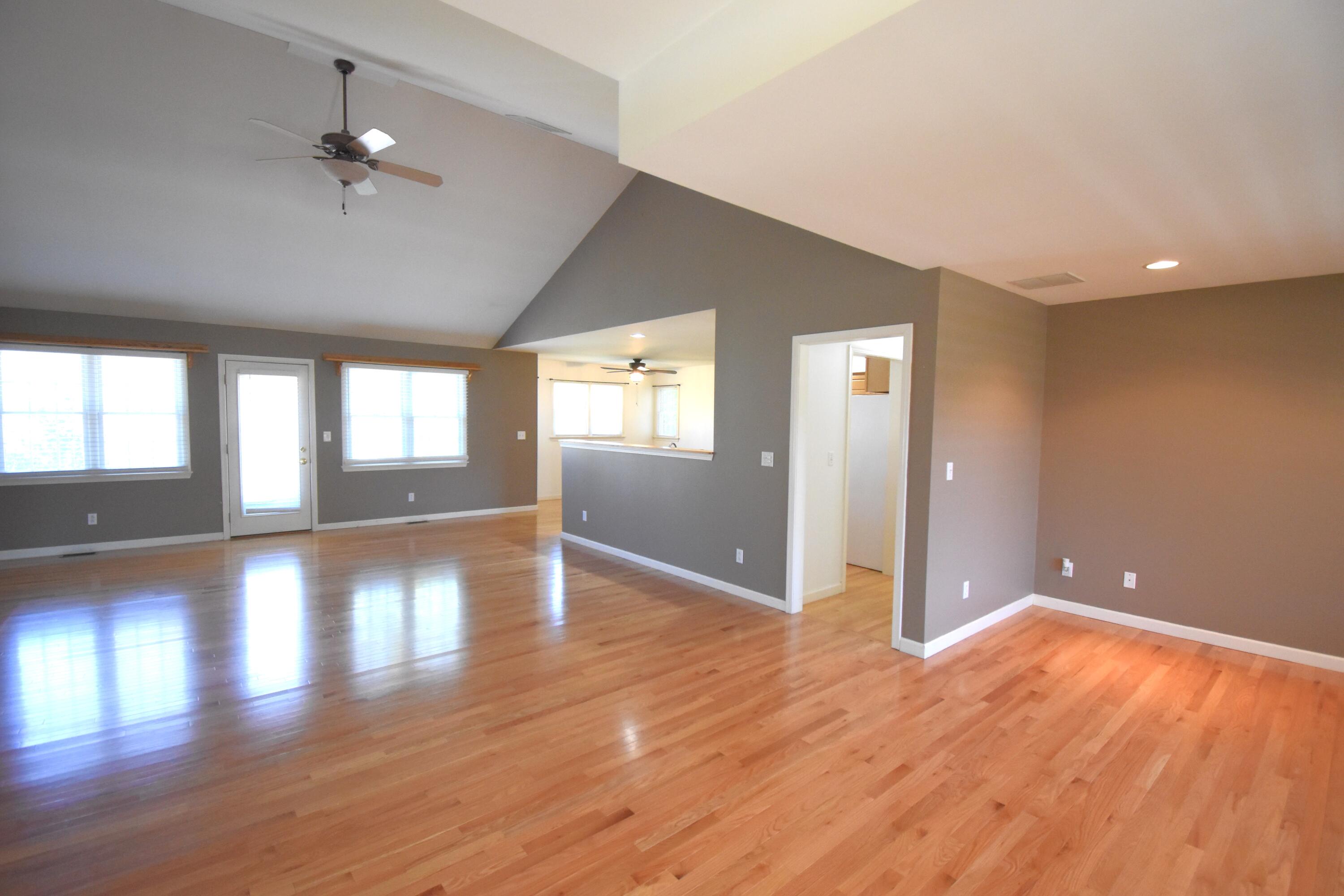 522 Pheasant Run Rensselaer, IN 47978 - Photo 16 of 55 wooden floor in an empty room with a window
