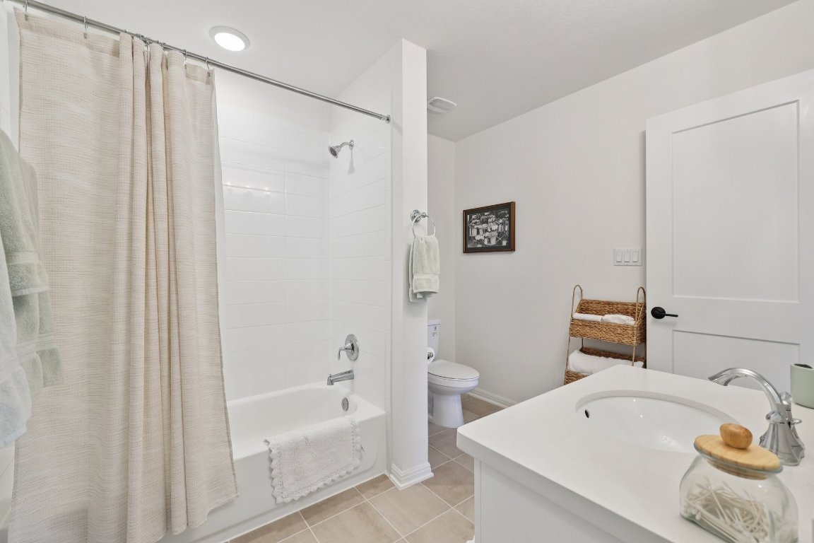 2913 Fallcrest Bend Leander, TX 78641 - Photo 29 of 40 a bathroom with a sink a toilet and shower