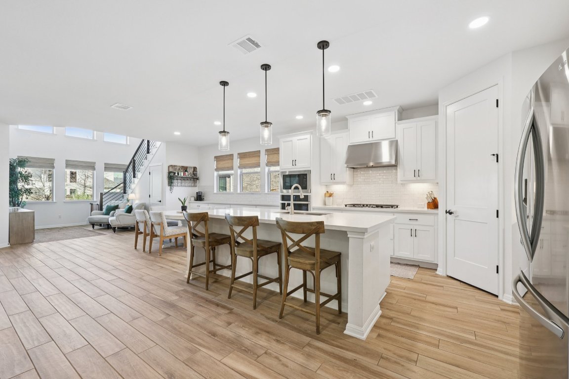2913 Fallcrest Bend Leander, TX 78641 - Photo 3 of 40 a large kitchen with lots of counter space and stainless steel appliances