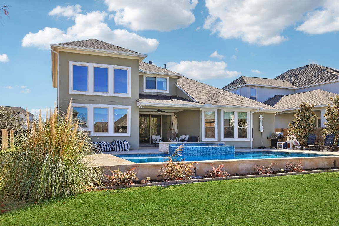 2913 Fallcrest Bend Leander, TX 78641 - Photo 31 of 40 a front view of a house with a yard table and chairs