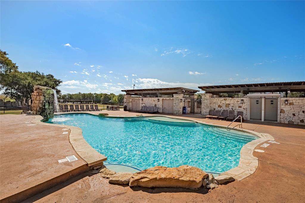 2913 Fallcrest Bend Leander, TX 78641 - Photo 39 of 40 a view of a swimming pool with a patio