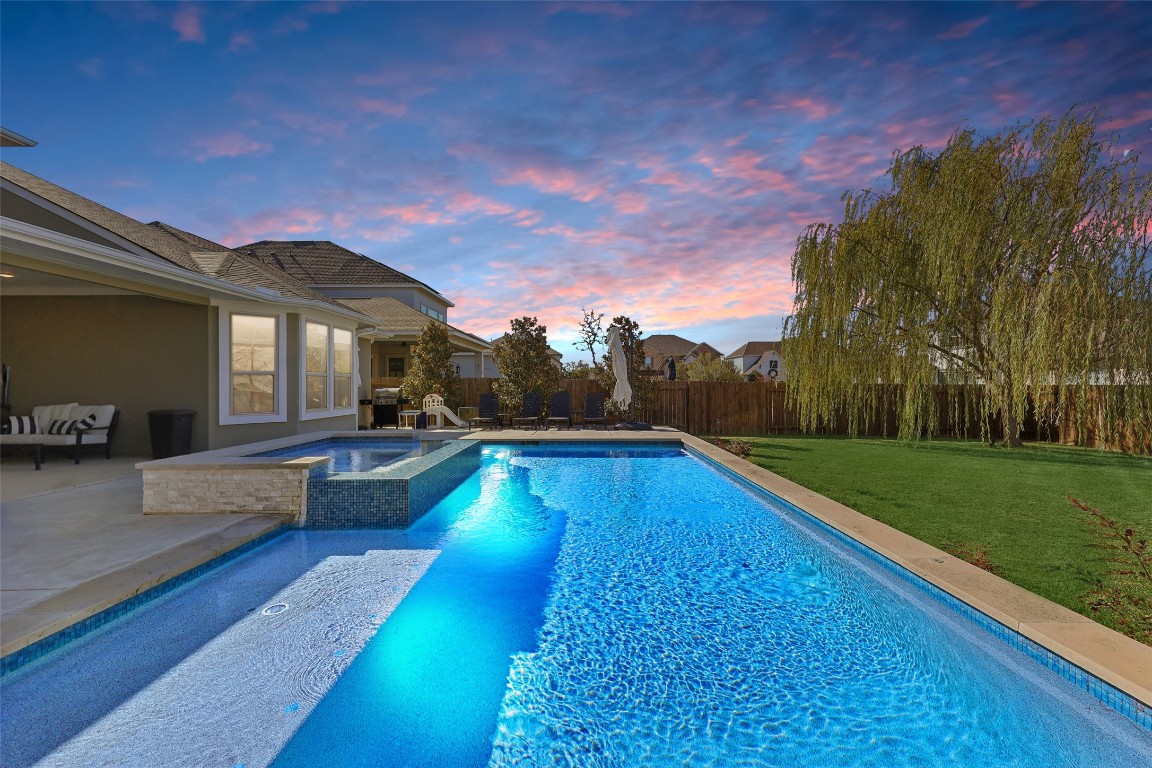 2913 Fallcrest Bend Leander, TX 78641 - Photo 5 of 40 a view of swimming pool with lounge chair and garden