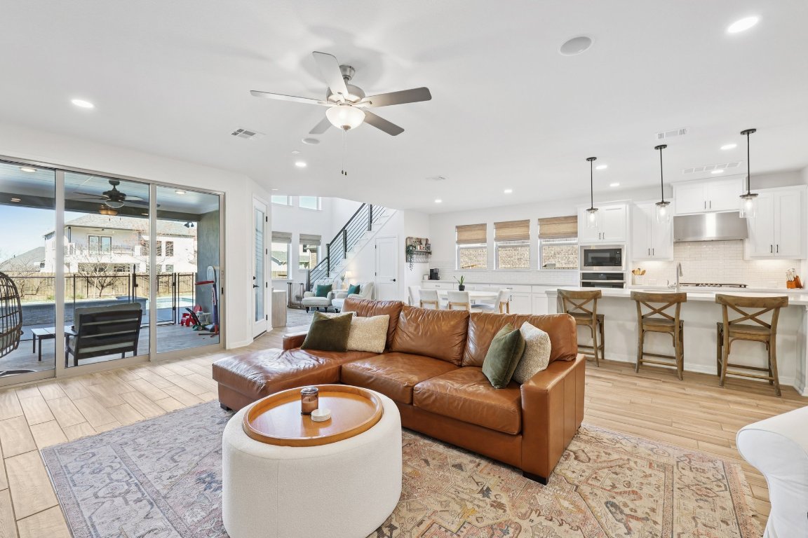 2913 Fallcrest Bend Leander, TX 78641 - Photo 10 of 40 a living room with furniture and kitchen view