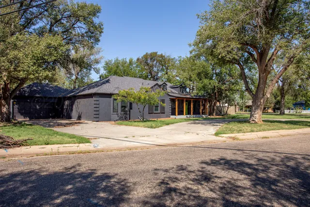 a house with trees in the background