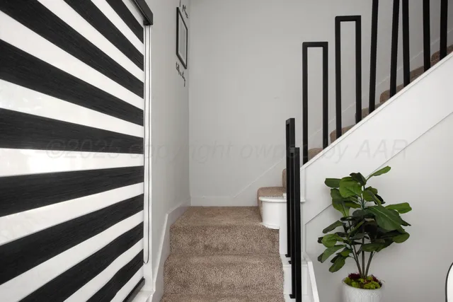 a view of staircase with wooden floor