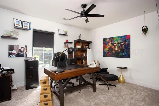 a view of a workspace with furniture