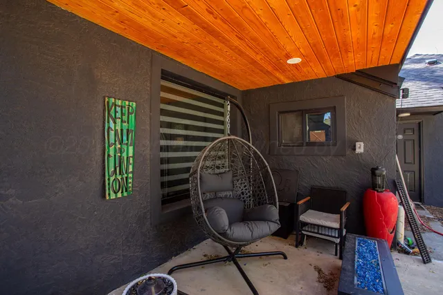 a backyard of a house with seating space