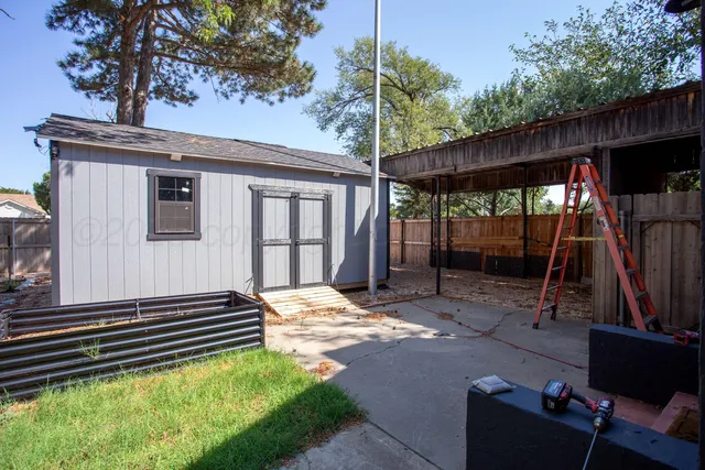a backyard of a house with seating space