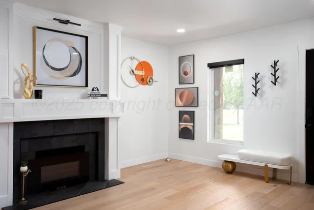 a view of a livingroom with furniture and a fireplace