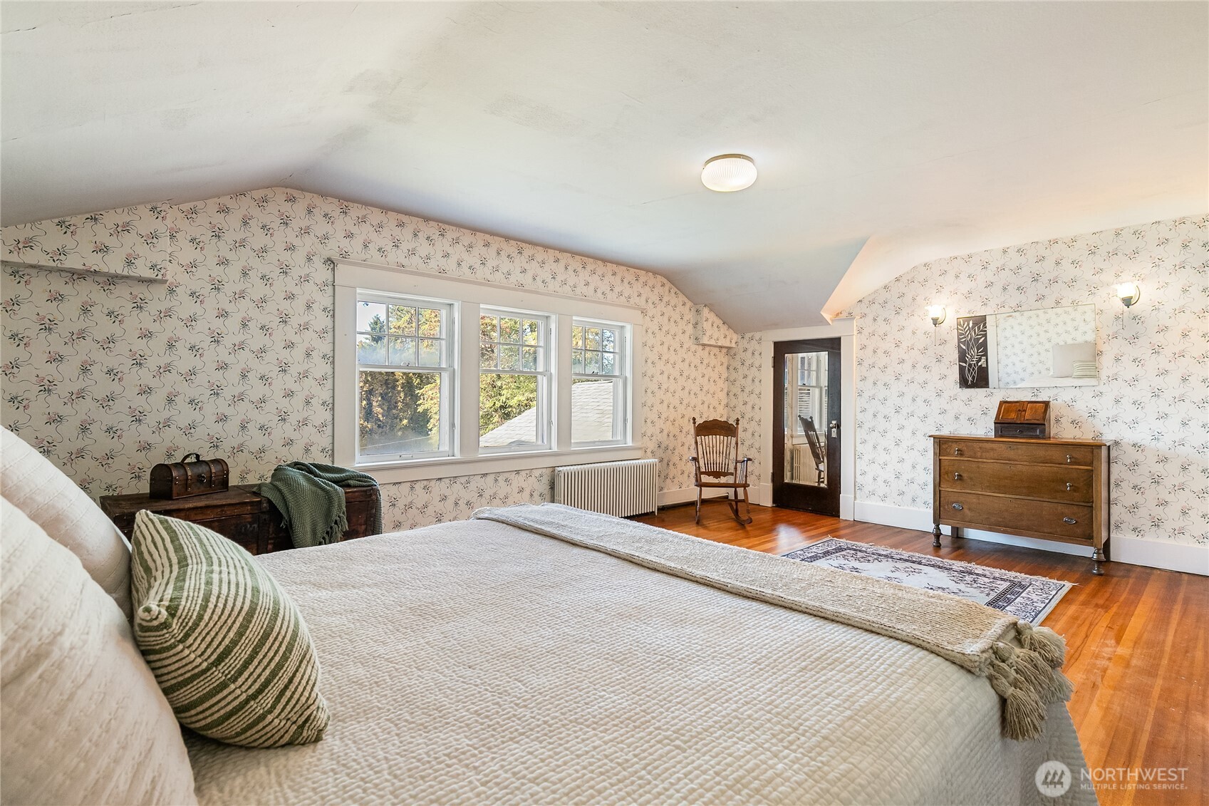 3905 Idaho Street Bellingham, WA 98229 - Photo 31 of 40 a bedroom with a bed and dresser with mirror