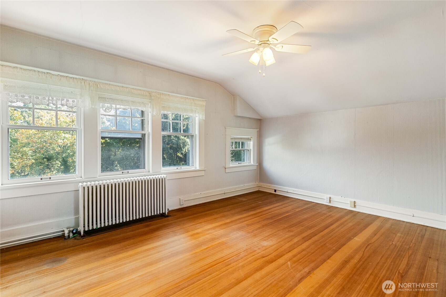 3905 Idaho Street Bellingham, WA 98229 - Photo 32 of 40 an empty room with wooden floor and windows