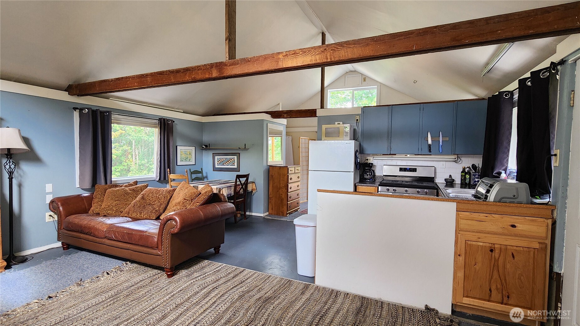 3905 Idaho Street Bellingham, WA 98229 - Photo 36 of 40 a living room with stainless steel appliances furniture and a kitchen view