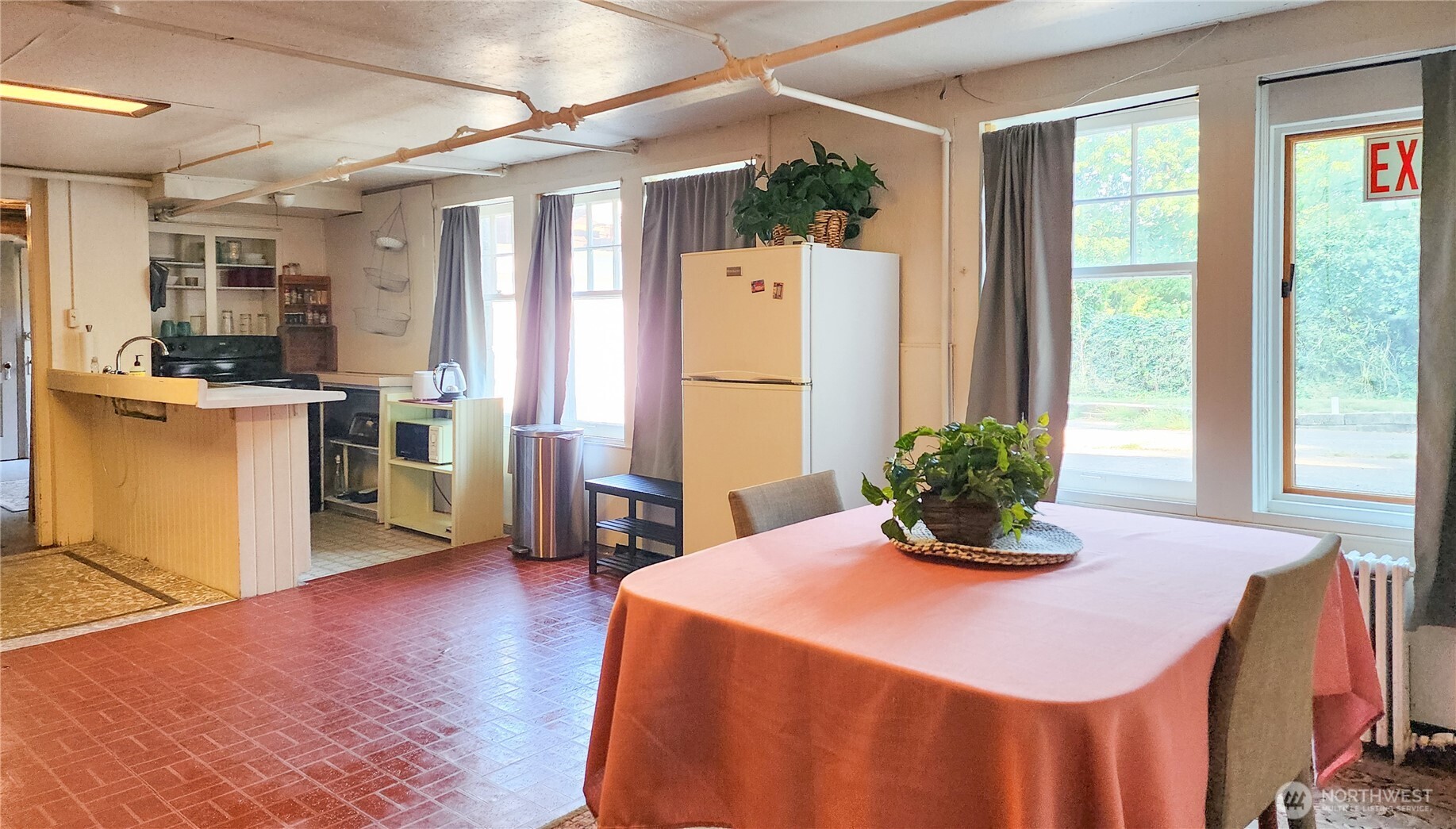 3905 Idaho Street Bellingham, WA 98229 - Photo 39 of 40 a kitchen with sink refrigerator dining table and chairs