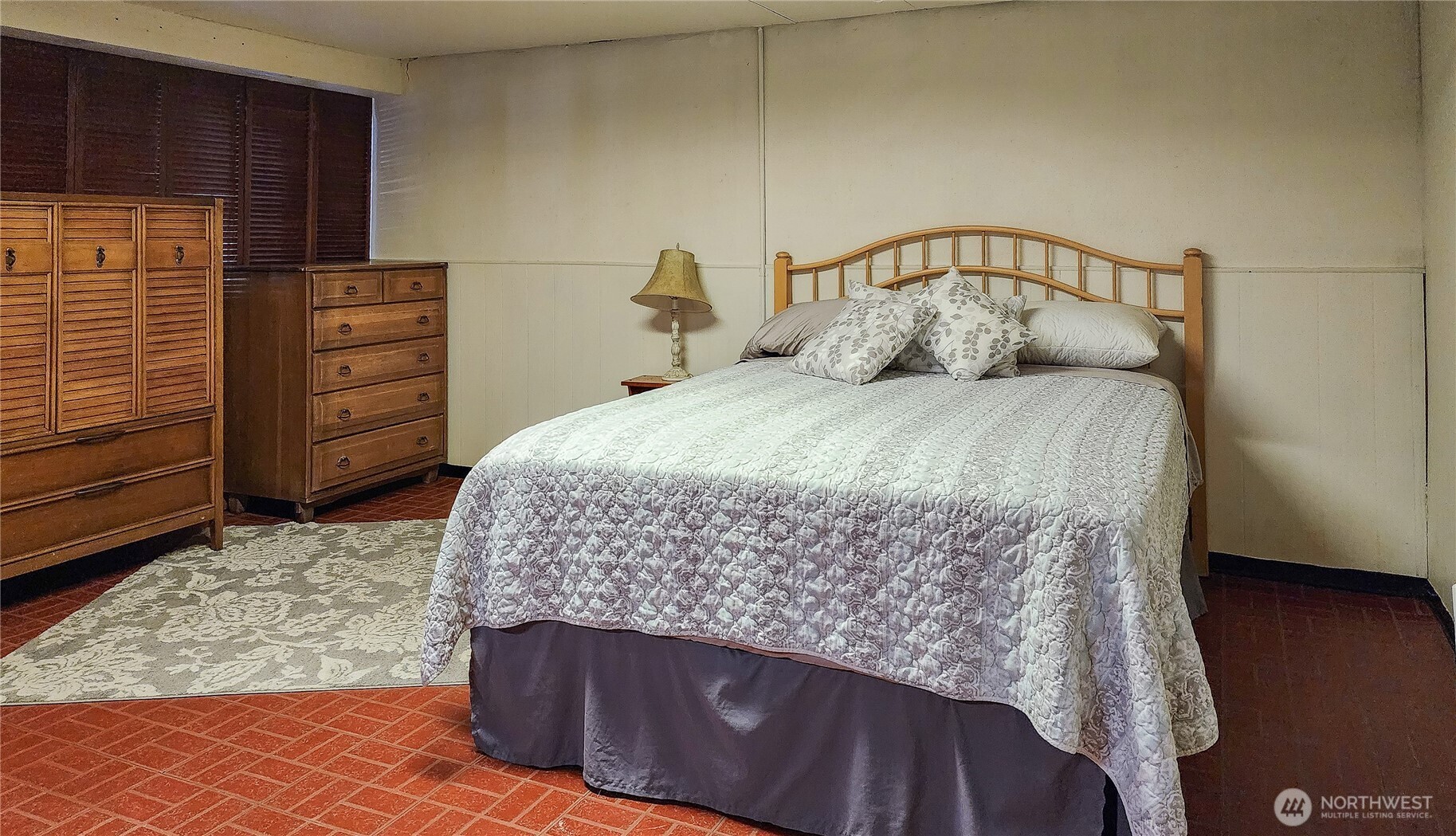 3905 Idaho Street Bellingham, WA 98229 - Photo 40 of 40 a bedroom with a bed and wooden floor