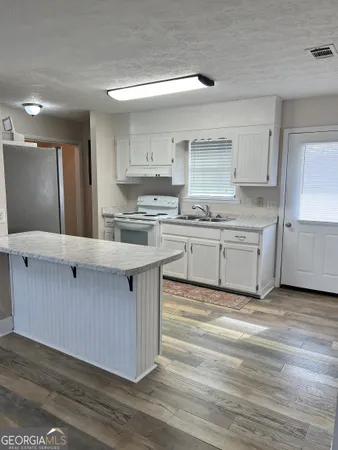 a large kitchen with cabinets