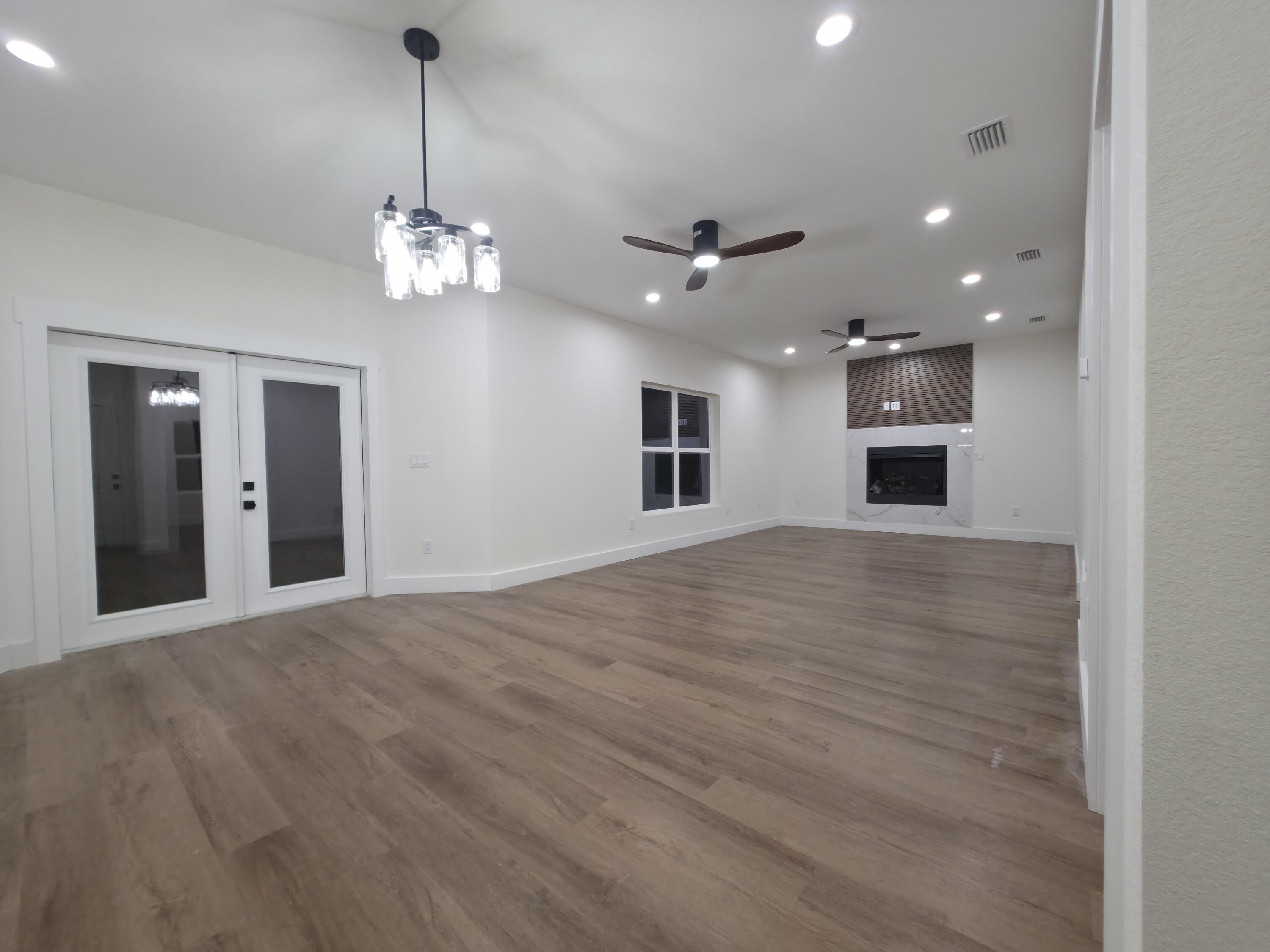 4699 Meadow Lake Drive Crestview, FL 32539 - Photo 11 of 38 a view of a livingroom with a chandelier furniture and a chandelier