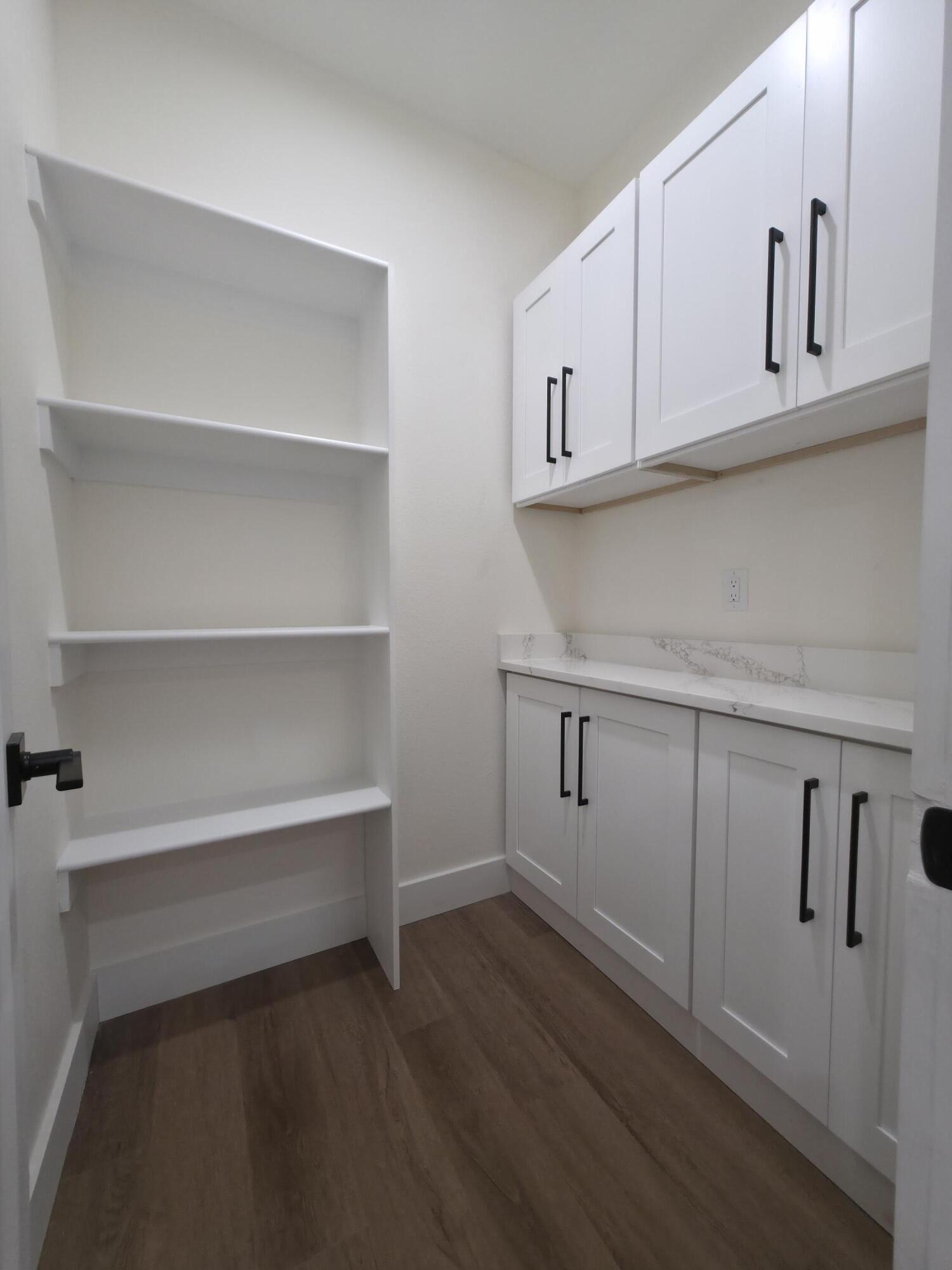 4699 Meadow Lake Drive Crestview, FL 32539 - Photo 15 of 38 a view of cabinets and wooden floor