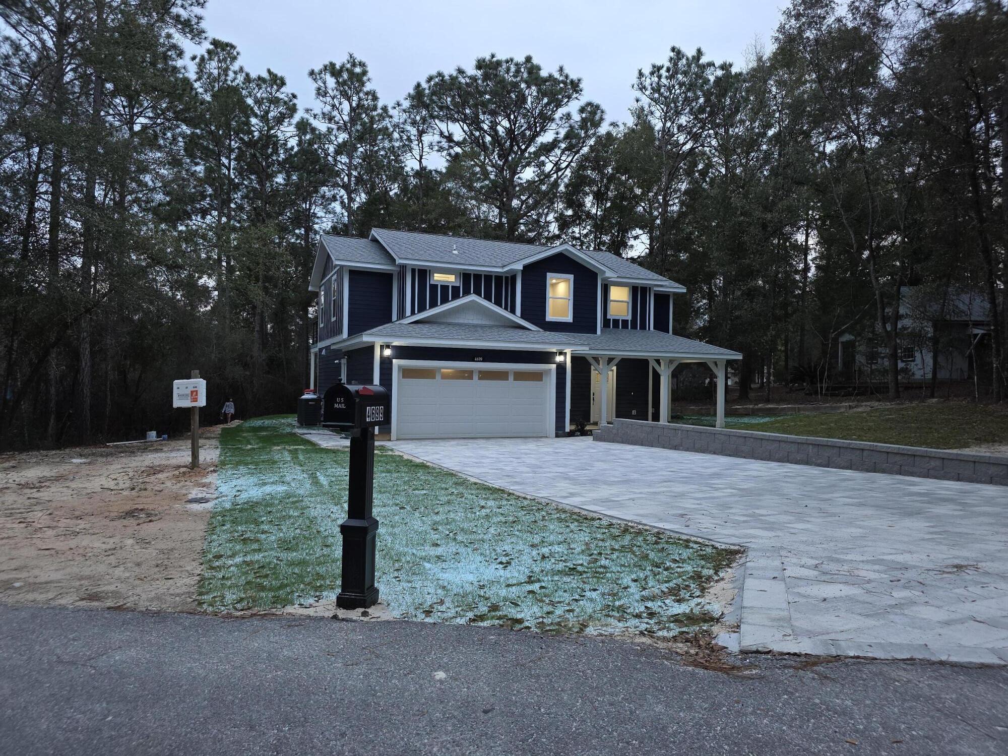 4699 Meadow Lake Drive Crestview, FL 32539 - Photo 2 of 38 a front view of a house with a yard
