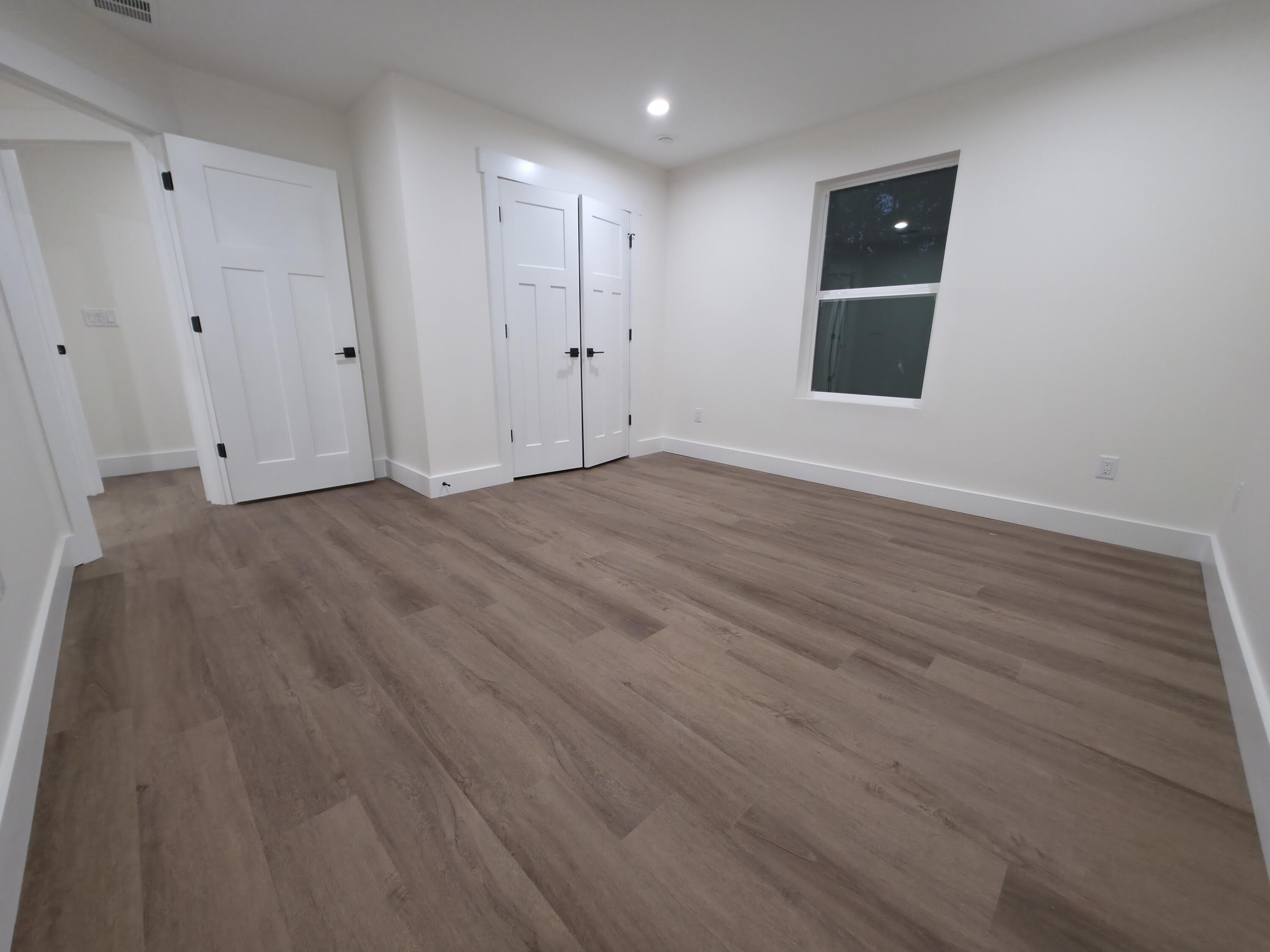 4699 Meadow Lake Drive Crestview, FL 32539 - Photo 22 of 38 a view of an empty room and wooden floor