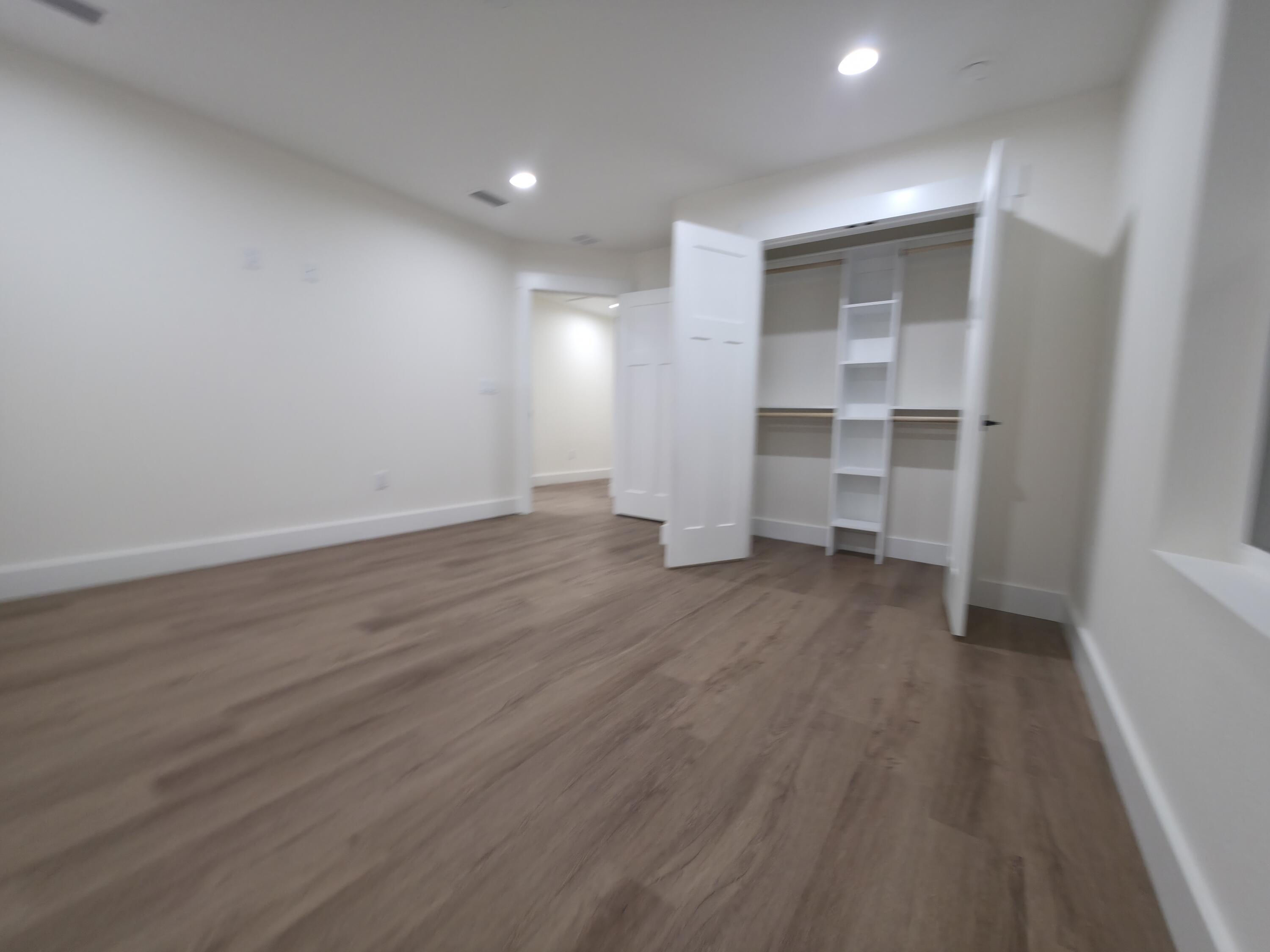 4699 Meadow Lake Drive Crestview, FL 32539 - Photo 24 of 38 wooden floor in an empty room with a window