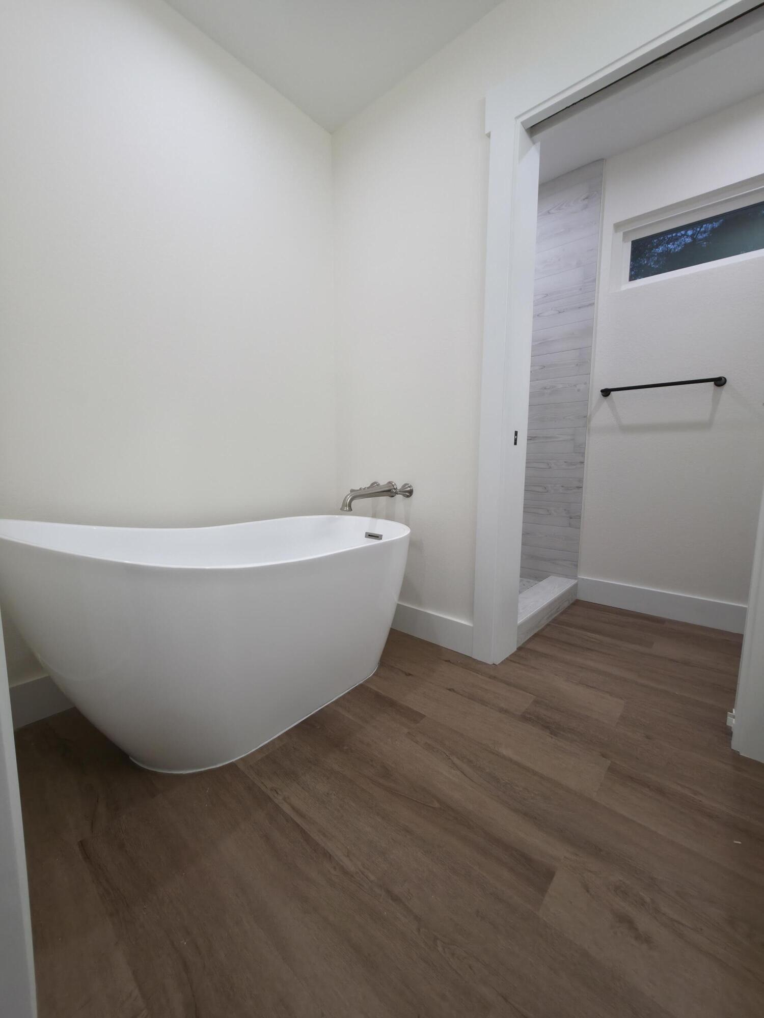 4699 Meadow Lake Drive Crestview, FL 32539 - Photo 30 of 38 a white bath tub sitting in a bathroom