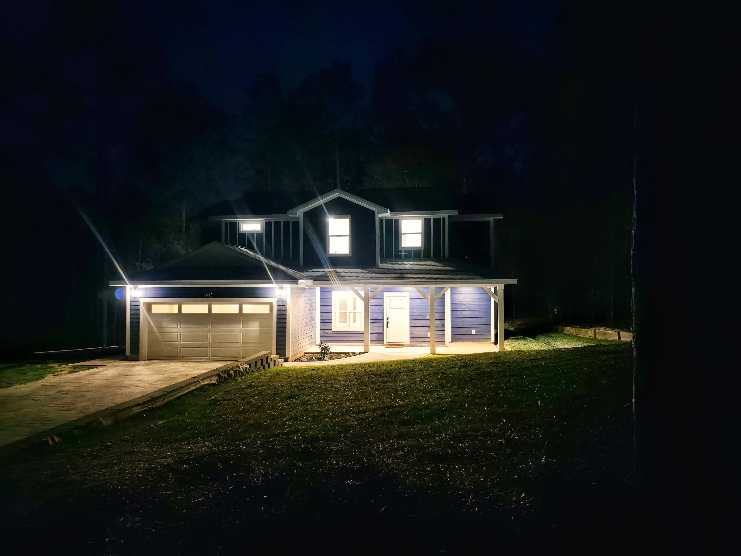 4699 Meadow Lake Drive Crestview, FL 32539 - Photo 3 of 38 a front view of a house with a yard