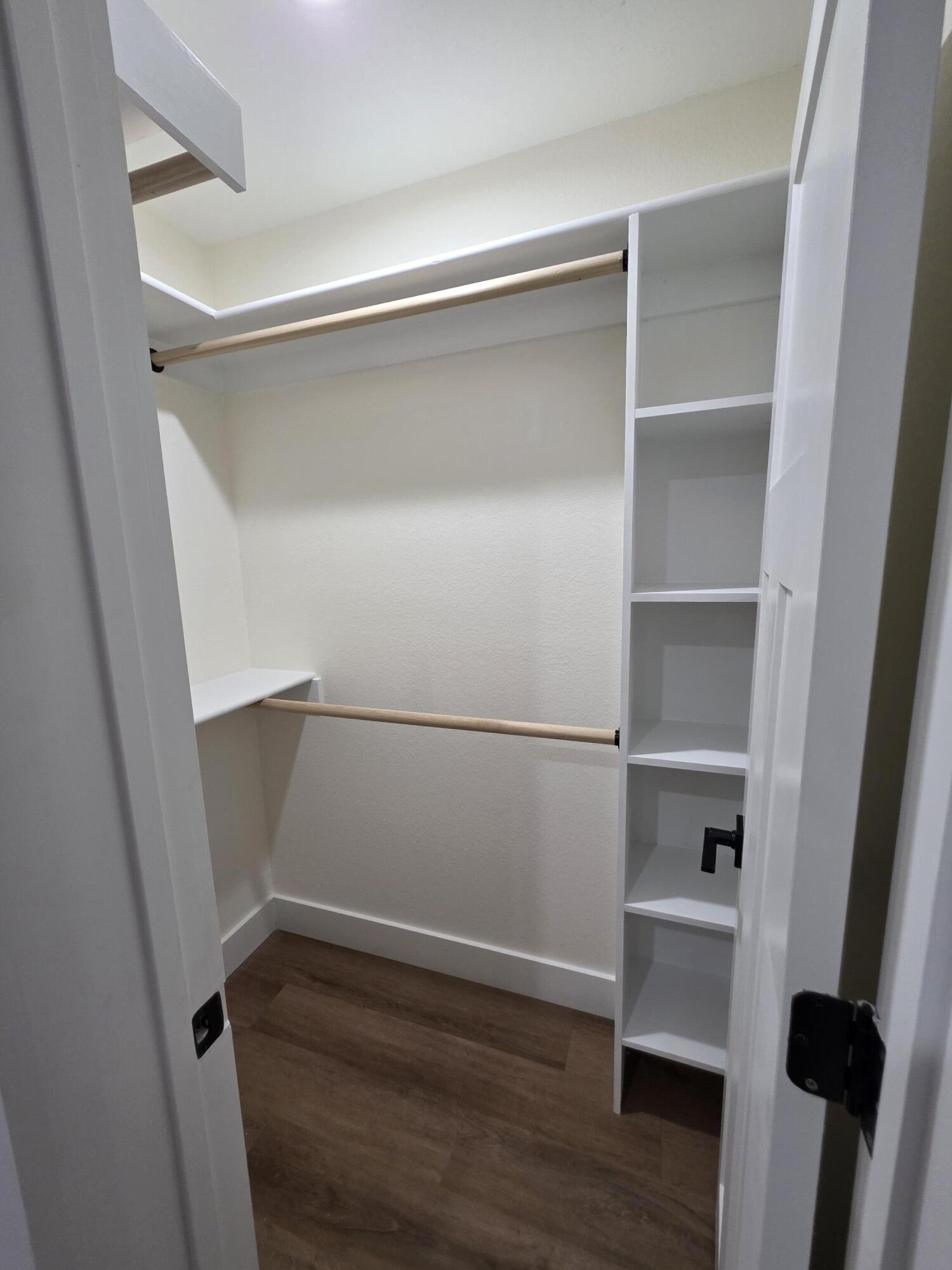 4699 Meadow Lake Drive Crestview, FL 32539 - Photo 32 of 38 a view of walk in closet with empty racks