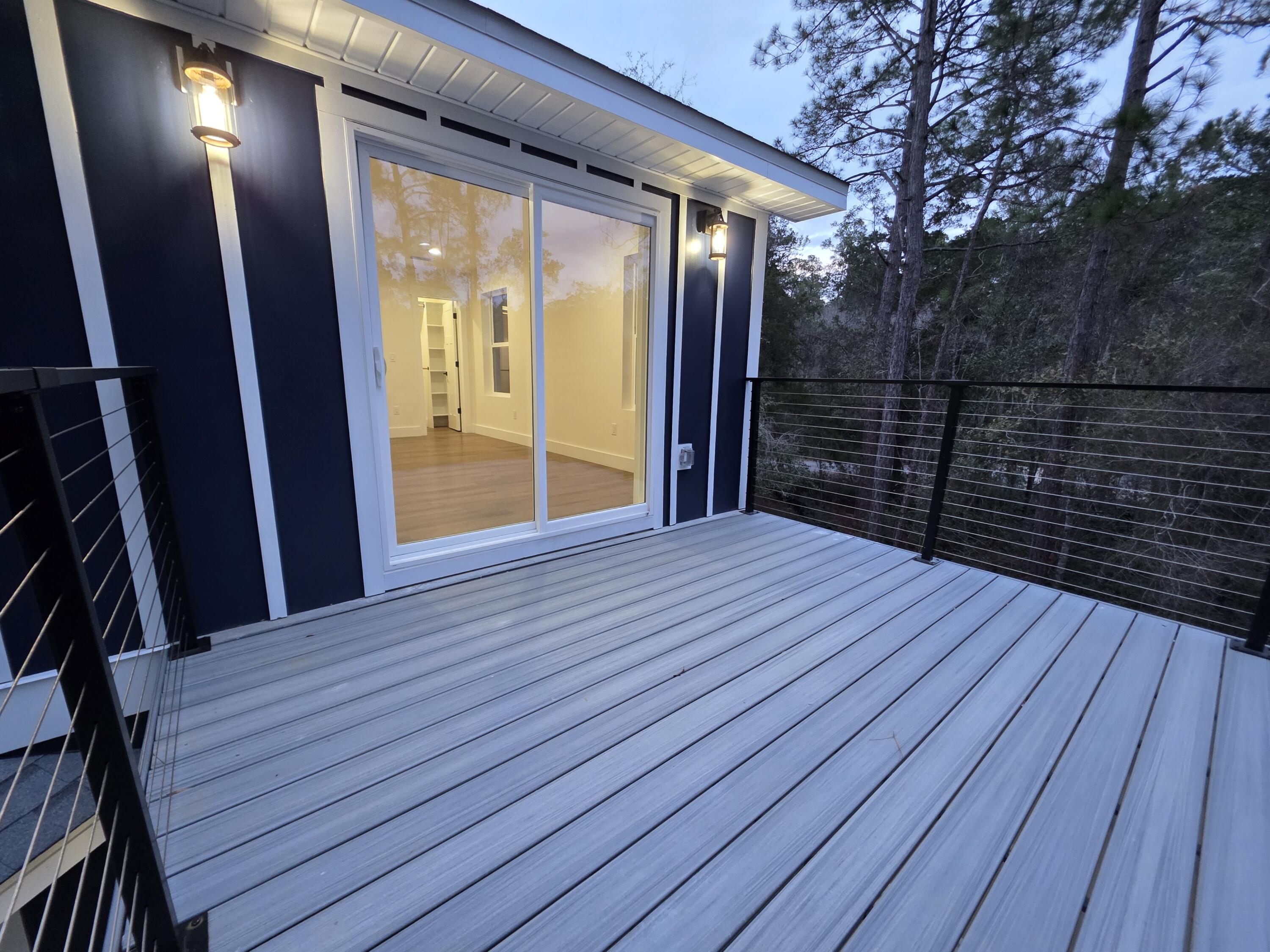4699 Meadow Lake Drive Crestview, FL 32539 - Photo 35 of 38 a view of wooden balcony
