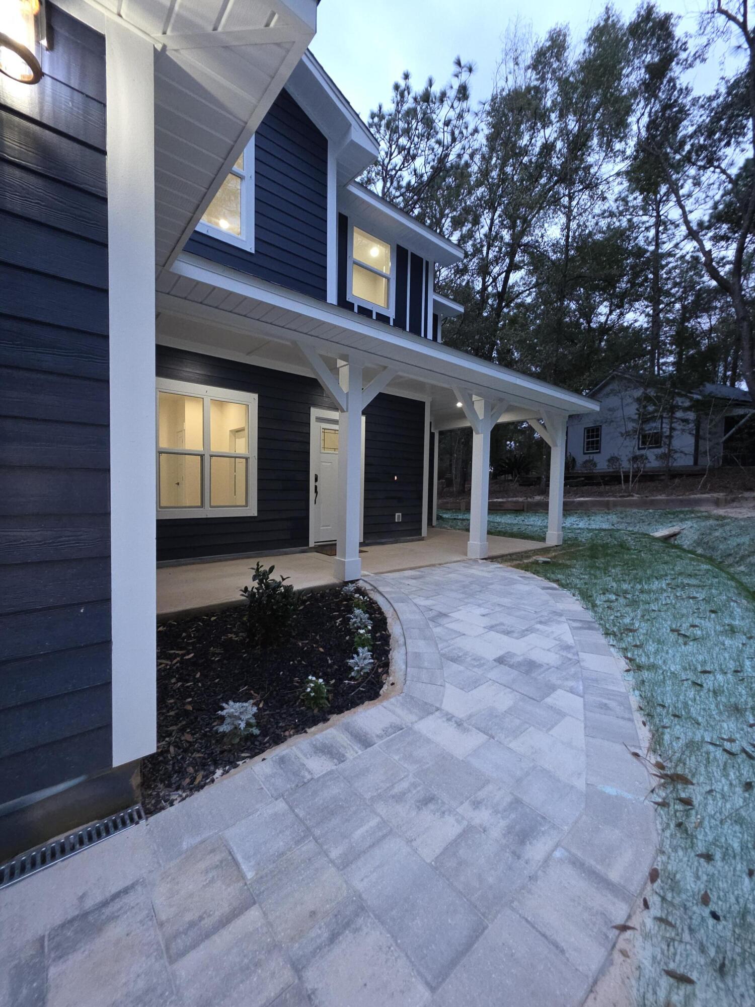 4699 Meadow Lake Drive Crestview, FL 32539 - Photo 4 of 38 a house view with a outdoor space
