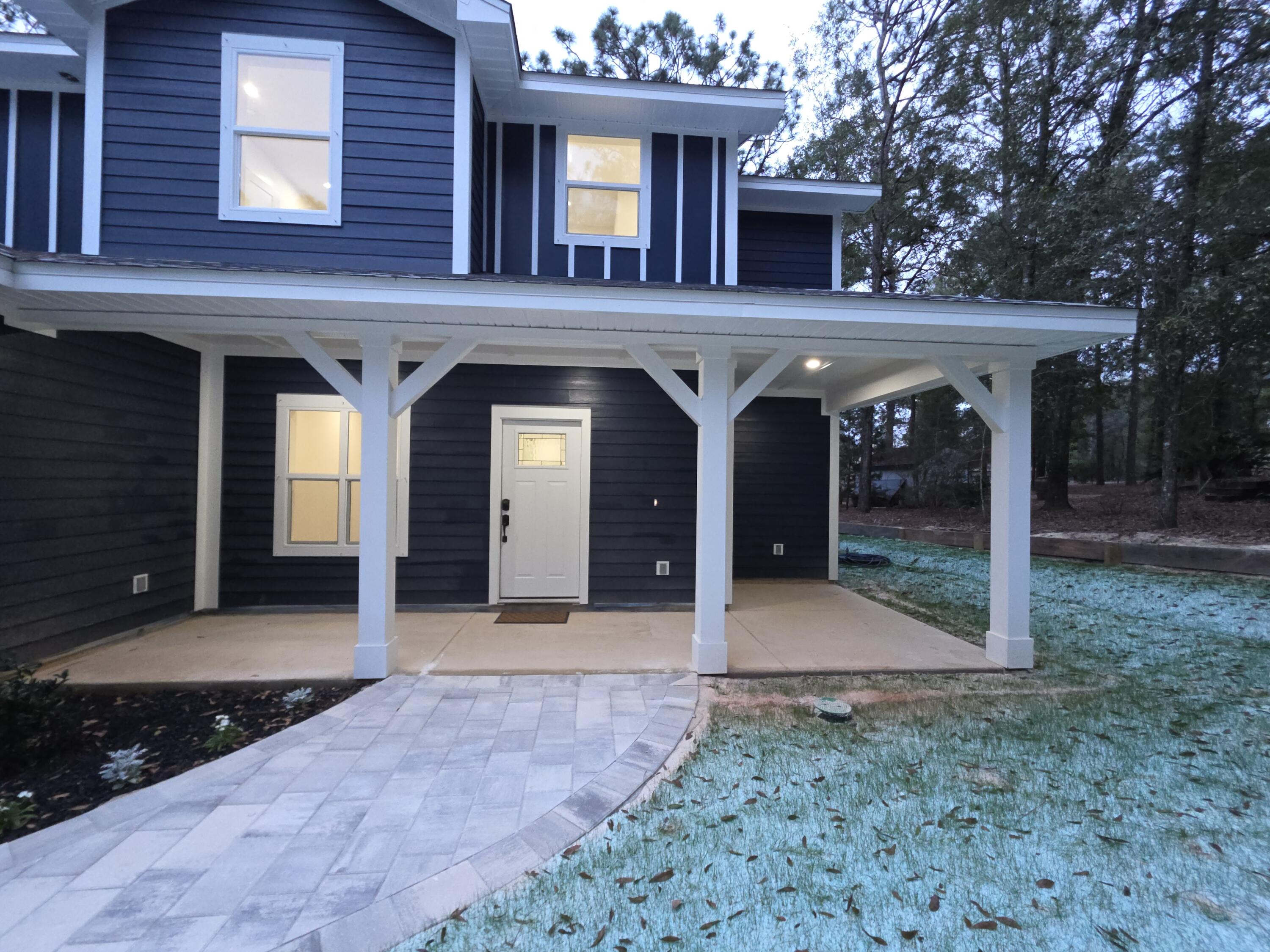 4699 Meadow Lake Drive Crestview, FL 32539 - Photo 5 of 38 a view of a house with a porch
