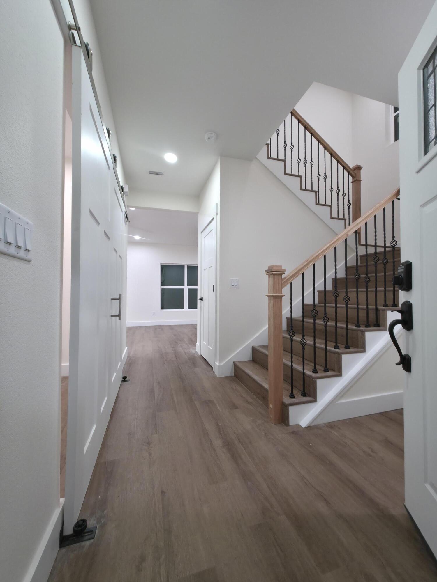 4699 Meadow Lake Drive Crestview, FL 32539 - Photo 6 of 38 a view of entryway and hall with wooden floor